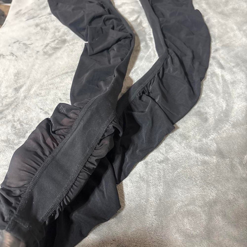 Black skinny leggings with see through detailing below thighs